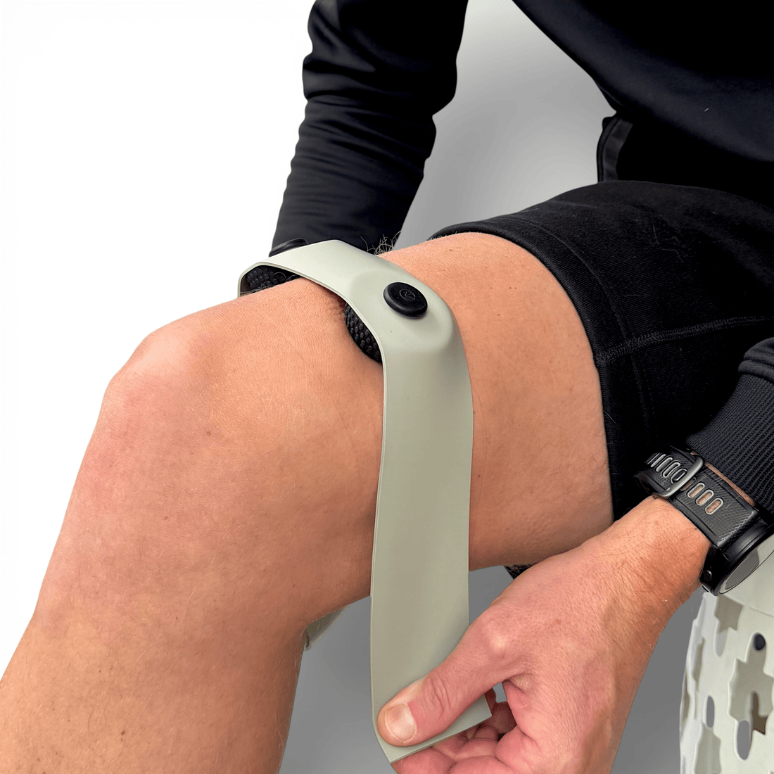 FlossPoint band with ShearPoints across distal quadriceps for knee extension restriction during step-ups and loaded knee flexion