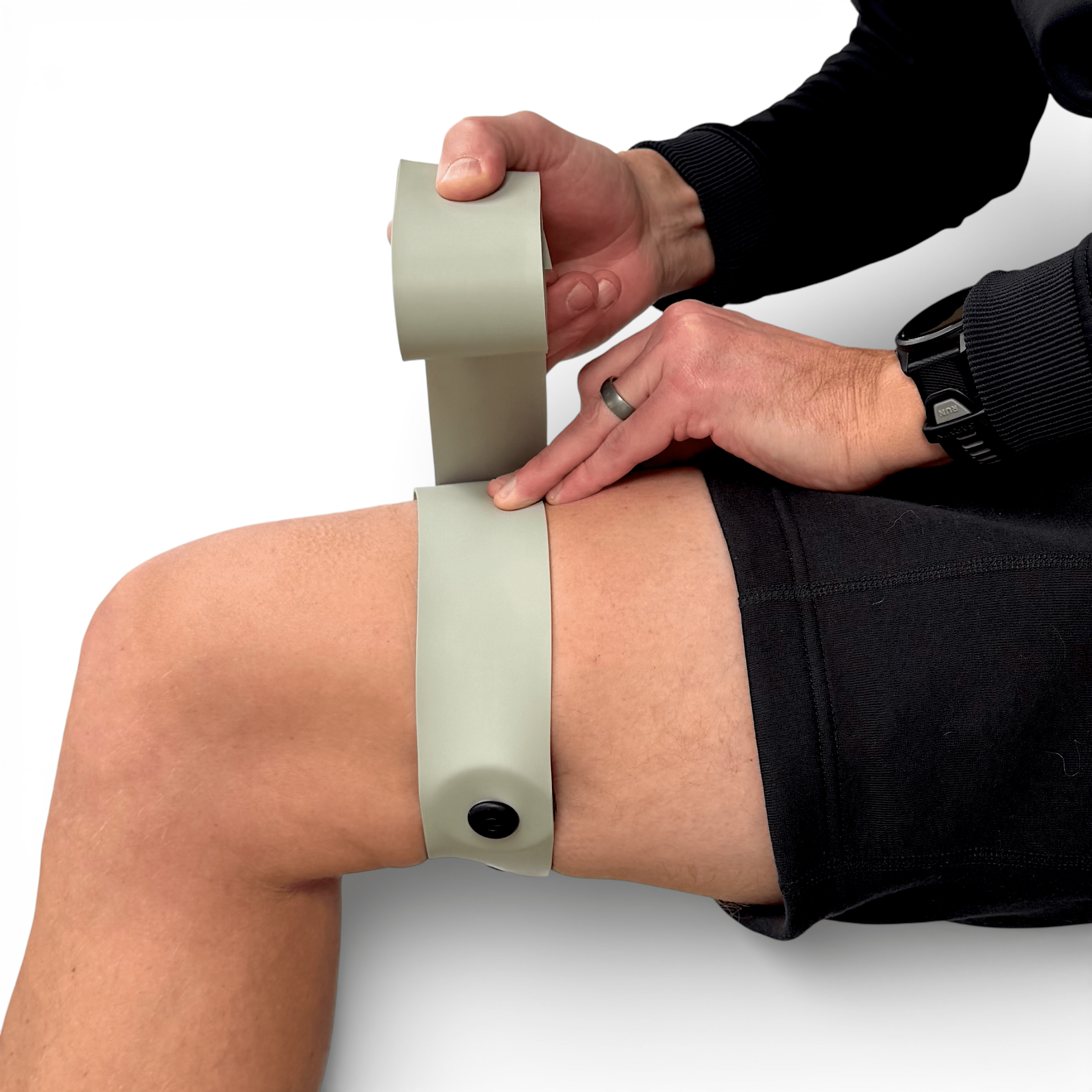 FlossPoint band with ShearPoints across proximal hamstring for hip hinge restriction during Romanian deadlifts and loaded movement