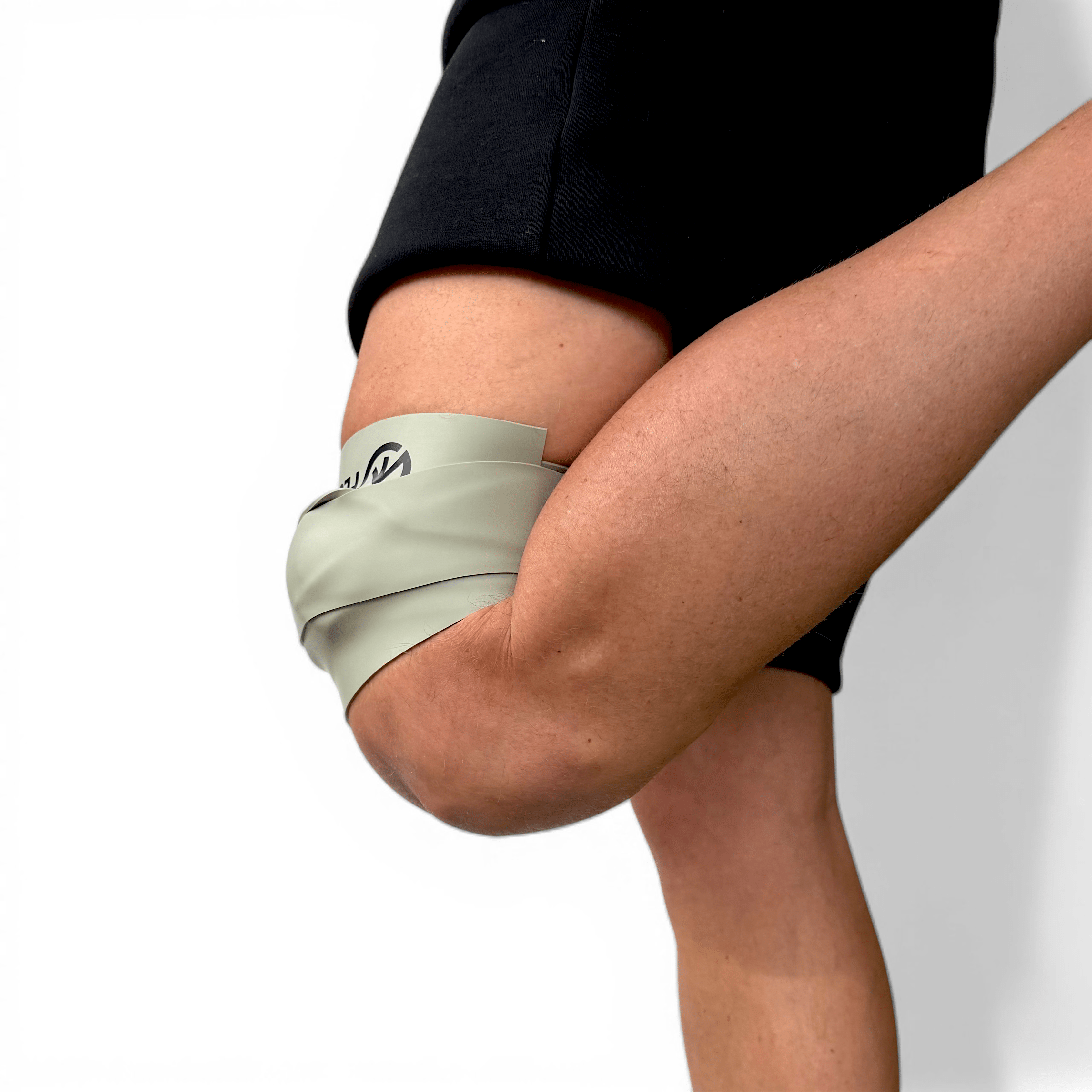 FlossPoint compression band with ShearPoints applied to lower extremity during loaded movement for tissue flossing and directional shear